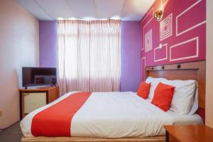 DJ Hotel Lumut客房内的一张或多张床位