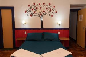 En eller flere senge i et værelse på Casa do Beco - Casa Inteira no Centro de Ouro Preto