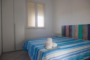 Posteľ alebo postele v izbe v ubytovaní Villa Al Mare Guest House