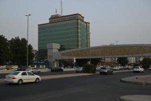 a busy city street with cars in front of a building at Platinum Seventy in Jeddah