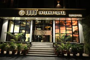 a building with a staircase in front of it at Hotel Trax International in Jamshedpur