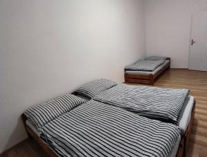 Postel nebo postele na pokoji v ubytování Apartmány Pražská