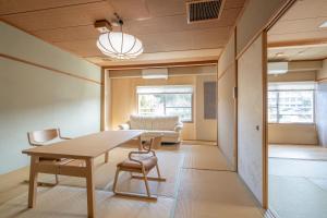 a room with a table and chairs and a couch at Koyokaku in Ureshino +46 photos