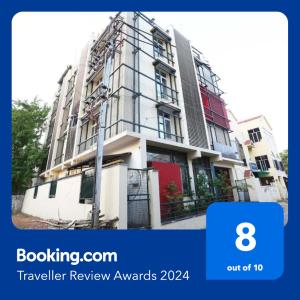 a building with a sign that says travel review awards at Hotel Vastukar Retreat in Bhubaneshwar