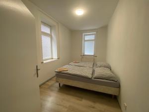Postel nebo postele na pokoji v ubytování Apartmány Pražská