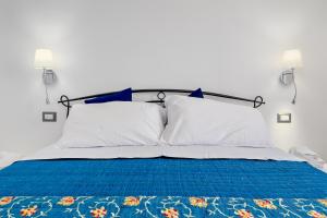 Ένα ή περισσότερα κρεβάτια σε δωμάτιο στο Residenza la perla