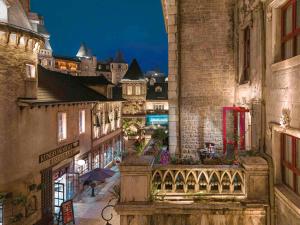 a view of a street in a city at night at Mercure Danang French Village Bana Hills in Da Nang