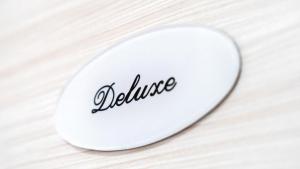 a white plate with the word justice written on it at Duomo Luxury Suite Catania in Catania