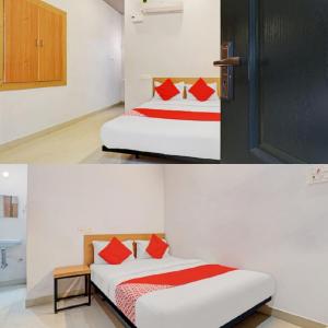 a bedroom with a bed with red pillows and a door at Hotel I Plaza in Tallākulam