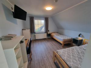 Ένα ή περισσότερα κρεβάτια σε δωμάτιο στο Dat Diekhus +5 φωτογραφίες