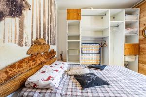 a bedroom with a bed with pillows on it at Il Baitino Innamorato in Pragelato