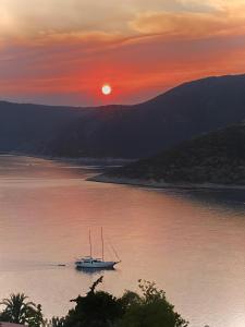 a boat sitting in the water at sunset at Patara Prince Hotel & Resort - Special Category in Kalkan