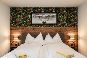 Postel nebo postele na pokoji v ubytování Melchtal Resort Apart Hotel