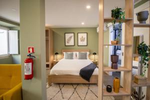 Ένα ή περισσότερα κρεβάτια σε δωμάτιο στο Loios Studios and Apartments