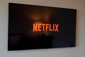a television screen with the words netflix on it at Seaside Apartment in Largs