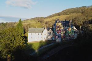 an aerial view of a castle on a hill at Seaside Apartment in Largs