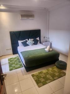 Кровать или кровати в номере Appartement Centre Gueliz Hanane