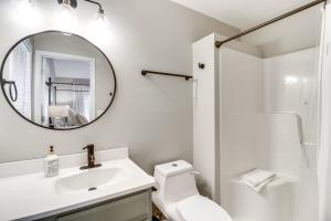 a white bathroom with a sink and a mirror at McGaheysville Vacation Rental, 1 Mi to Skiing! in McGaheysville +20 photos