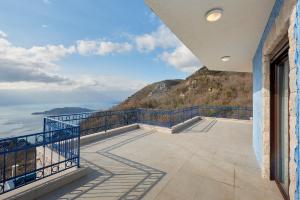 a balcony with a view of a mountain at Sunbreeze Delux Vilas in Budva