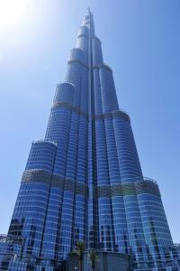 a tall building with a blue sky in the background at Armani Hotel Dubai in Dubai