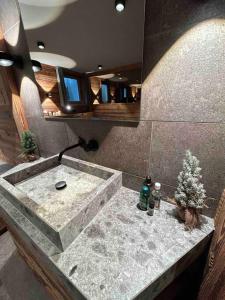 a bathroom with a sink with a christmas tree on it at Spa, Sport & City Luxury Ski-in Ski-Out Apartment in Kitzbühel