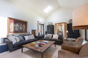 a living room with couches and a coffee table at LXR Villa with breathtaking views to the Mediterranean 4 HAB in Torremuelle