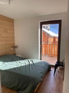 Ένα ή περισσότερα κρεβάτια σε δωμάτιο στο Chalet Saint Victor, Praz sur Arly