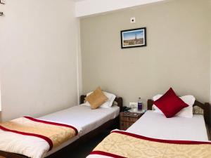 Lova arba lovos apgyvendinimo įstaigoje Satiya Guest House