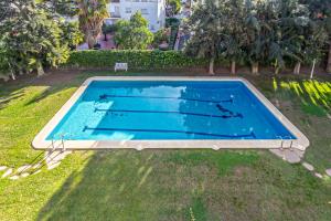 an overhead view of a swimming pool in the grass at Tango in Sitges