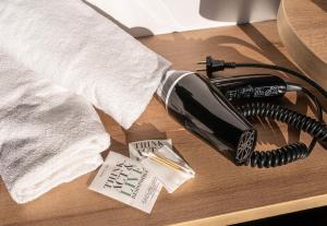 a telephone sitting on a table with a receipt at B&B HOTEL Mulhouse Bâle Aéroport in Hésingue