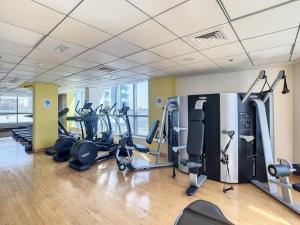 a gym with several treadmills and cardio machines at Exclusive Newly Renovated 1BR full Marina views in Dubai