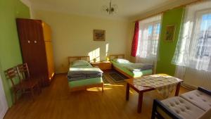 Postel nebo postele na pokoji v ubytování Apartman pod Zamkem