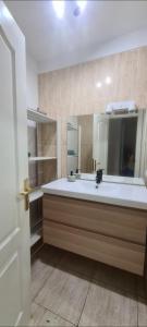 a bathroom with a sink and a mirror at CANDELARIA SOL Y MAR in Candelaria