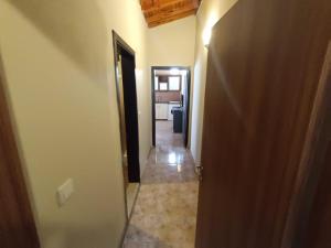 a hallway with a door leading to a room at Dove Apart Hotel in Fethiye