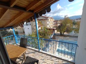a balcony with a table and a view of a pool at Dove Apart Hotel in Fethiye