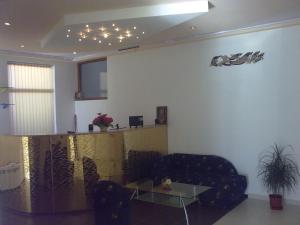 a living room with a couch and a table at Hotel Gazei in Bansko