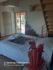 Postel nebo postele na pokoji v ubytování Un coin de paradis