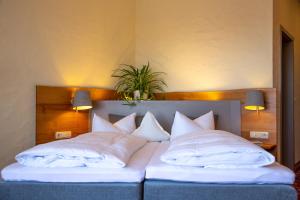 Postel nebo postele na pokoji v ubytování Hotel Sonnentau
