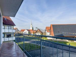 a view from the balcony of a building with solar panels at Ferienwohnung Lichtblick in Friedrichshafen