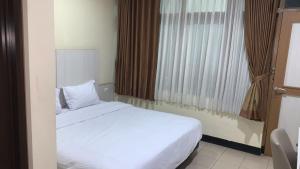 Postelja oz. postelje v sobi nastanitve tekMIRA Hotel