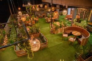 an overhead view of a restaurant with plants and lights at HOTEL RANSAM in Āīzawl