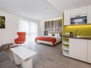 Posteľ alebo postele v izbe v ubytovaní Eco Suite Hotel