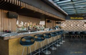 a bar with a row of stools in a restaurant at 10 Karakoy in Istanbul