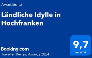 un signe bleu dont le texte est traduit en anglais dans l'établissement Ländliche Idylle in Hochfranken, à Regnitzlosau