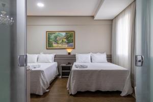 Hotel Dan Inn Uberlandia By Nacional Inn客房内的一张或多张床位