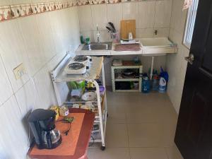 Kuchyň nebo kuchyňský kout v ubytování Acogedora vivienda anexa en un barrio tranquilo + 7 fotografií