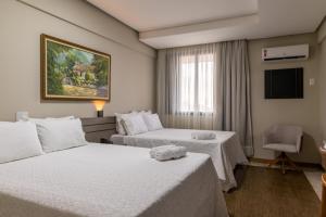 Hotel Dan Inn Uberlandia By Nacional Inn客房内的一张或多张床位