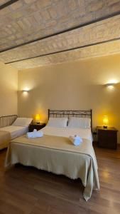 Cama o camas de una habitación en Holiday Suite Roma