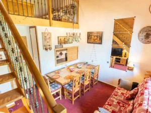 a dining room with a table and chairs in a room at Appartement Valmorel, 4 pièces, 8 personnes - FR-1-291-784 in Valmorel
