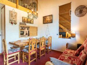 a dining room with a table and chairs at Appartement Valmorel, 4 pièces, 8 personnes - FR-1-291-784 in Valmorel